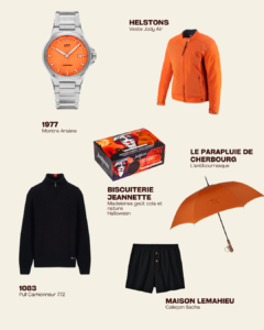 Sélection de produits pour l’automne sur fond beige : montre orange 1977, veste orange Helstons, assortiment de madeleines Halloween Biscuiterie Jeannette, parapluie orange Le Parapluie de Cherbourg, pull noir 1083 et caleçon noir Maison Lemahieu.
